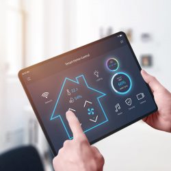 All in one smart home control system app concept on tablet display in man hands